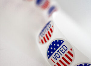 Roll of I Voted Stickers on a white background as a general subject for the blog on Presidential Elections and the Stock Market